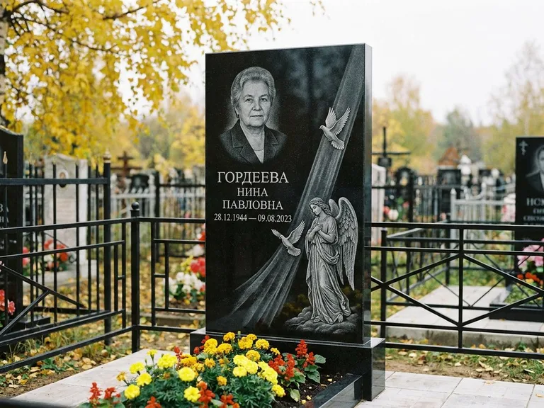 Памятник с гравировкой ангела — гравировка ангела с голубем по диагонали стелы, работа «Гордеева» в Тюмени