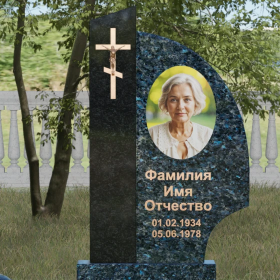 Памятник — крыло с распятием и шарами, гранит Блю Перл, в Якутске